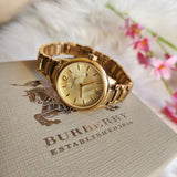Burberry The Classic Champagne Dial Gold Steel Strap Watch for Women - BU10109